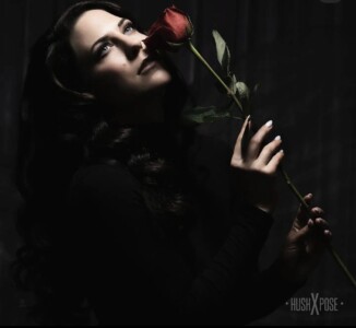 woman holding single rose